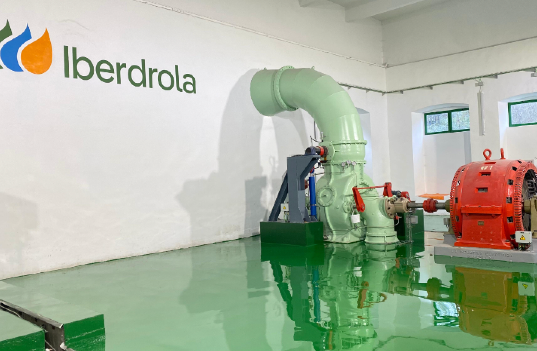 Interior of a hydroelectric power plant with turbine and electric generator