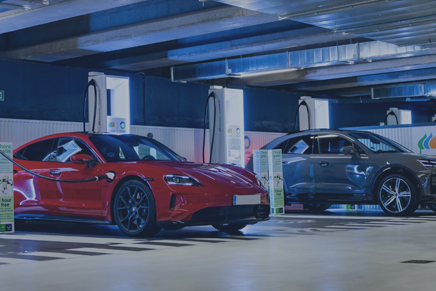 Two electric cars charging at an Iberdrola charging point