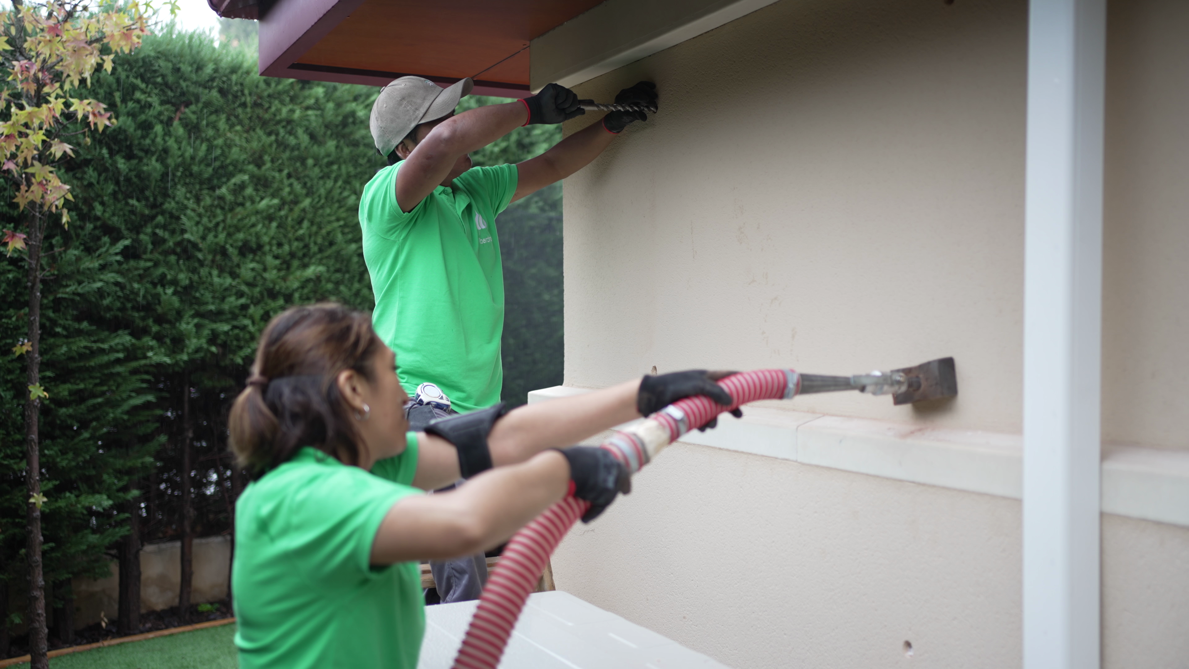 Technician performs maintenance on rural power pole next to service vehicle
