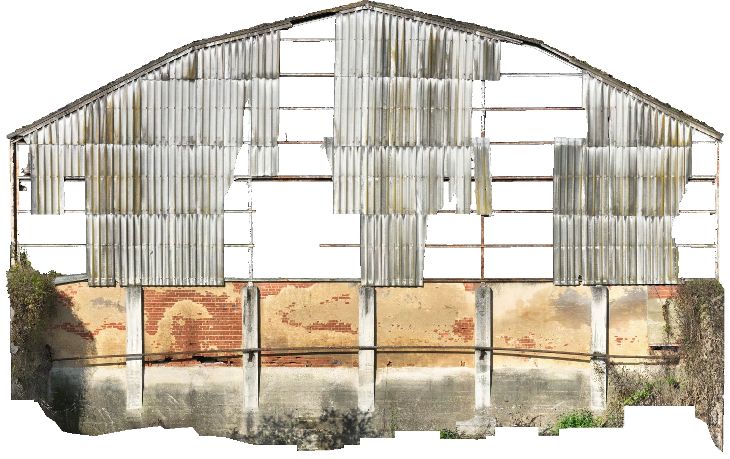 End façade of a Nitrastur industrial building with partially preserved metal cladding.